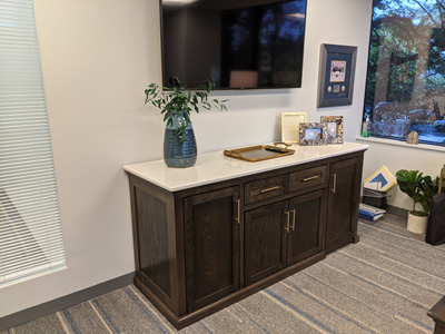Shown in mission style with a warm toffee stain on white oak. This beautiful Buffet Credenza Storage is a nice addition to your office, dining room or living space. Behind the credenza doors is a pull-out printer shelf on the left and a mini refrigerator fit in the right side.