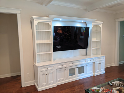 Custom Mission Style Entertainment Center with Flat Trim, Crown Molding shown in Pure White on Maple and Brushed Nickel Knobs
