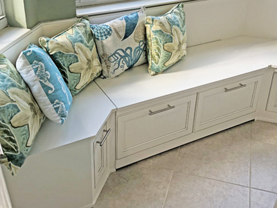 Custom Wrap-Around Banquette with Drawers shown in Greek Villa + Glazing Gray Shaker on Maple and Standard Nickel Bar Handles