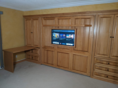 Traditional Style King Wall Bed and Side Cabinet Piers with Shelf Leg, Hidden Table and Attached TV shown in Golden Stain on Maple