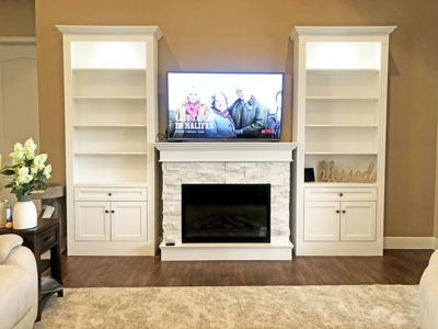 Custom Built-In Traditional Bookcases and Shaker Cabinets with Fireplace. Shown in Solid Bright White on Maple
