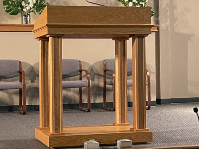 Custom Podium with Lift Up Lid with Storage shown in Natural on Oak