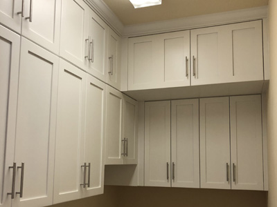 Custom Shaker Laundry Room Storage Cabinets shown in Solid Bright White on Maple