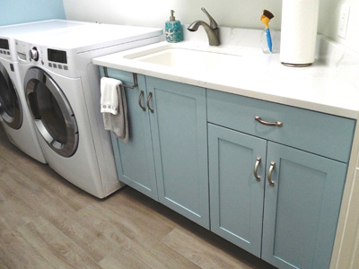 Laundry Cabinetry and Space Organization in Custom Mission Shaker Blue on Maple