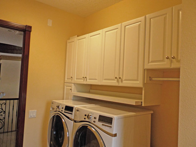 Laundry Cabinetry and Space Organization in Traditional Style shown in Solid Bright White on Maple