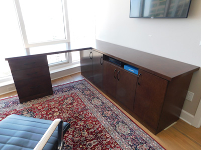 Modern Real Wood Desk, Workstation for a Home Office - Custom Corner Wood Countertop shown in Rosewood on Maple. 3 Drawer Cabinet with 1 File Drawer and 2 Storage Drawers. 1 Cabinet with 2 Doors and Adjustable Shelf. Custom Console with Adjustable Shelf