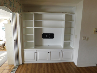Custom Built-In Traditional Media Cabinet in Pure White on Maple
