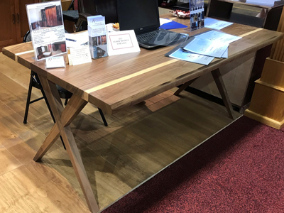 Two-Tone multi functional, style table or desk. This is a multi-functional table or desk shown in walnut with a natural ash inset.