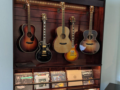 Custom Guitar Display and Storage Cabinet with Record Display Section on Top, CD Sections below and 2 Large Drawers on Bottom shown in Red Mahogany on Maple