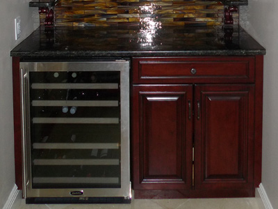 Traditional Custom Built-In Wine & Beverage Center shown in Red Mahogany on Maple