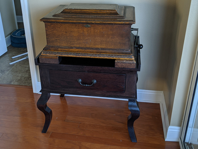 Custom Music Box and Records Stand Shown in Java Stain on Oak. We built the stand with one drawer. Legs are needed for stability.  Music box weighs 100+/- pounds.