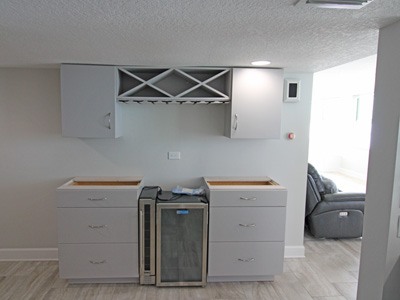 Custom Modern Bar & Cabinets with Soft Close Hinges, Undermount Soft Close Drawer Glides, Stemware Holder, Upper Wine Rack shown in Custom Essential Gray on Maple