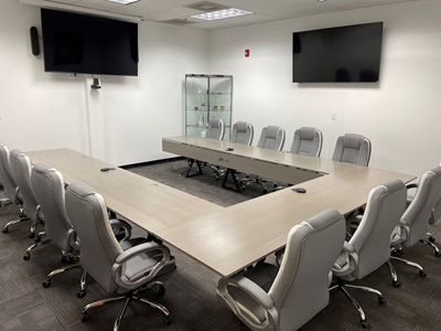 Custom Conference Room Tables Shown in Heavy Gray on Red Oak