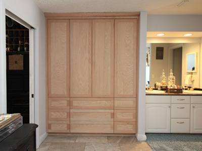 Custom Built-In Shaker Storage Cabinet with Shaker Drawers on Bottom and Shaker Doors Above (3 Adjustable Shelves), 3” Crown Molding shown in Unfinished Solid Oak