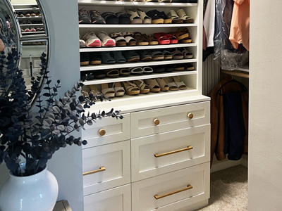Custom Dresser Chest for Closet with 6 Shaker Panel Drawers and Custom Open Shoe Cabinet above Chest with 8 Adjustable Shelves shown in Custom Wimborne White on Oak with Specialty Knobs and Pulls