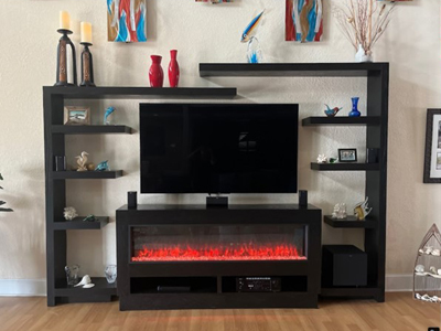 Custom Floating Shelf System with Fireplace Console is Shown in Ebony on Oak