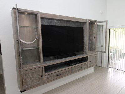 Custom Mission Shaker Floating Entertainment Center with Glass Shelves, LED Lights shown in Custom Driftwood Gray on Oak