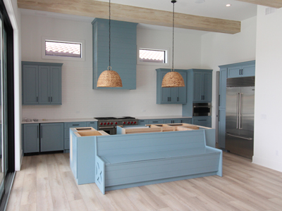 Best Wood Cabinets Pinellas County Custom Kitchen Range Hood Cover with Shiplap on Face and Sides shown in Whirlpool Blue on Red Oak