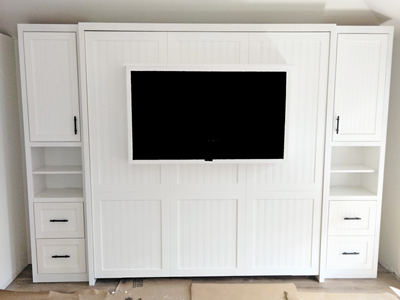 Custom Shaker King Vertical Murphy Wall Bed, 7” Shelf Leg with Beadboard Shaker Panels and Side Pier Cabinets Shown in Accent Bright White on Red Oak with Specialty Pulls