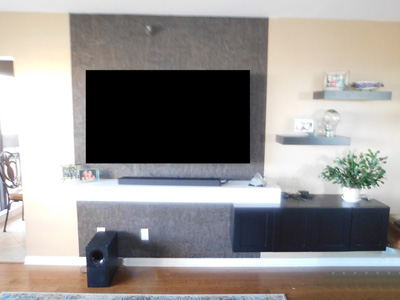 Custom Floating Shelf System with Console is Shown in Ebony on Oak