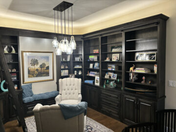 Custom Built-In Traditional Library Cabinetry with Base Cabinets and Bookcase Hutches, Bench Seat and Sliding Wooden Ladder shown in Custom Match Webb Oak Stain on Maple