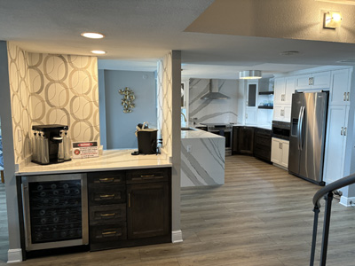 Lower Base Shaker Cabinets and Floating Shelves shown in Custom Color Match and Cambria Quartz Countertops with Profile Edge