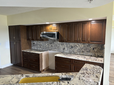 Custom Traditional Kitchen Cabinets with Raised Panel Drawers and Doors Shown in Custom Chestnut on Maple with Champagne Bronze Pulls and Knobs