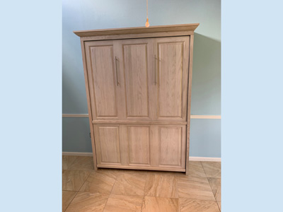 Traditional Full Murphy Wall Bed with Hidden Flip Up Leg and Long Nickel Bar Handles shown in Whitewash on Oak 