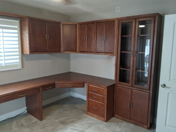 Real Wood Savona Style Murphy Wall Bed with Home Office in Rosewood Stain on Maple. Upper Storage Cabinets and Display/Storage Cabinet. Corner Home Office with Spacious Work Areas