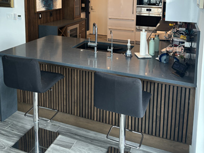 Custom Kitchen Island Cabinet with ¾” Maple Euro Boxes with Flat Fronts with Walnut Horizontal Grain shown in Custom Stain to Color Match (Dark Walnut)