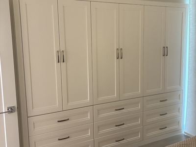 Custom Built-In Wardrobe Closet Storage Drawers shown in Solid Bright White on Maple