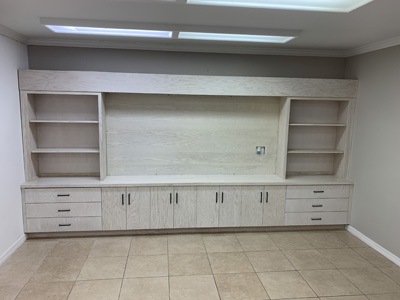 Custom Modern Built-In Wall to Wall Entertainment Center Shown in Whitewash on Oak