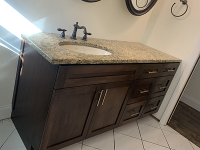 Custom Shaker Bathroom Vanity Cabinet shown in Espresso on Maple with Champagne Bronze Pulls