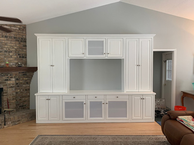 Custom Traditional Entertainment Center with Raised Panel Doors, Slab Drawers, Adjustable Shelves, White Speaker Cloth, Printer Pull-Out Shelf, 3” Crown Molding, Flat Trim and 3