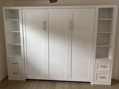 Shaker Panel King Vertical Wall Bed and Custom Shaker Pier Cabinets shown in Accent Bright White on Maple with Nickel Bar Pulls