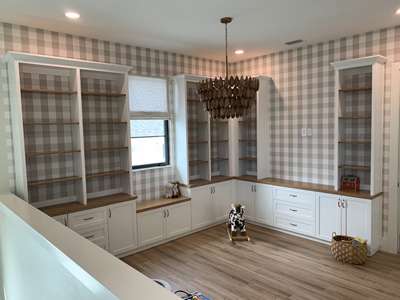 Custom Modern Cabinets and Window Seat with Shaker Doors and Drawers shown in Accent Bright White on Maple, Oak Stained Countertop and Champagne Bronze Pulls