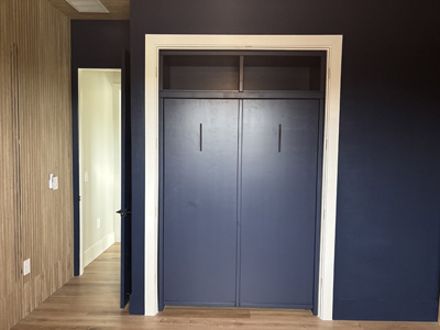 Savona Full Vertical Murphy Wall Bed with Custom Upper Cabinet shown in Naval on Maple