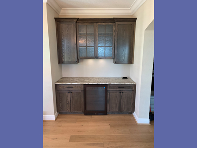 Custom Built-In Dry Bar and Wood Frame Textured Glass Doors with Mullion Moldings shown in Warm Toffee on Oak