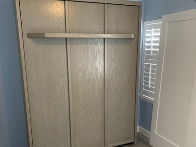 Savona Murphy Wall Bed with 7” Shelf Leg shown in Soft Gray on Oak