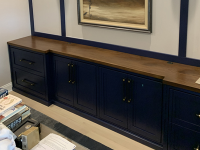Custom Built-In Credenza with 4 Shaker Panel Doors and Drawers and Board and Batten wall shown in Navy and Coffee on Maple