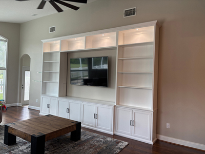 Custom Shaker Entertainment Center shown in Bright White on Maple with LED Lights and Crown Molding