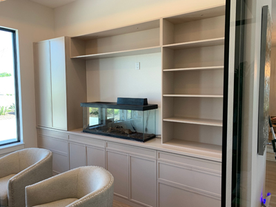 Custom Skinny Shaker Built-In Home Office Cabinets with Fixed and Adjustable Shelves, Soft Close Doors and Drawers shown in Sand Dune on Maple