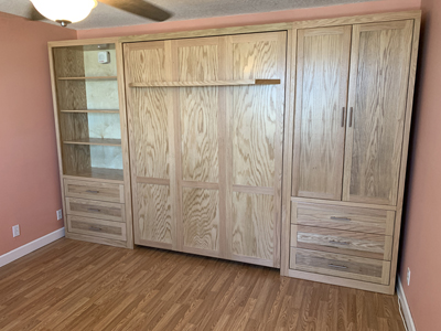 Shaker Panel Queen Murphy Wall Bed with Shelf Leg and Side Piers shown in Natural Stain on Oak with Nickel Pulls