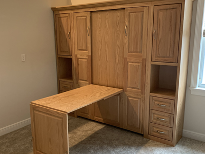 Traditional Full Murphy Wall Bed with Hidden 9 Panel Desk and Nightstand Side Piers shown in Natural Stain on Oak