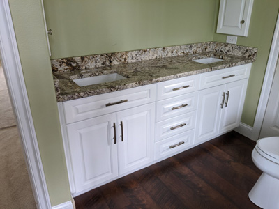 Custom Traditional Bathroom Double Sink Vanity shown in Bright White on Maple