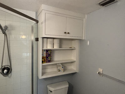 Custom Modern Over the Toilet Cabinet with 2 Small Flat Doors and 3 Openings Below Shown in Greek Villa on Maple with Champagne Bronze Knobs