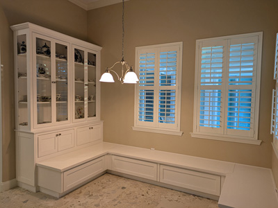 Custom Built-In Shaker Window Seat Banquette with Storage and China Cabinet shown in Accent Bright White on Maple