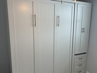 Shaker Panel Queen Vertical Murphy Wall Bed with 3 Long Shaker Panels and Hidden Desk in Pier shown in Sea Salt on Maple