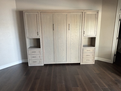 Shaker 3 Panel Queen Vertical Murphy Wall Bed and Side Piers shown in Soft Gray on Oak